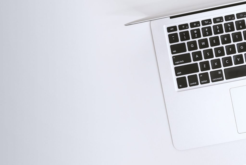The Importance Of Data Protection For Business | Learn These 7 Essential Strategies Now 3 A Macbook pro on a white table