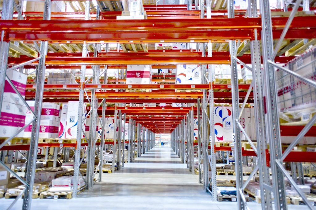 8 Proven Strategies For Effective Warehouse Organization System 1 Production, Logistics center, Modern warehouse image.