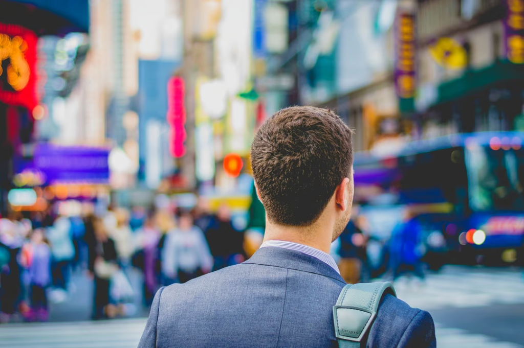 Career Path Confusion? Here'S How To Make A Choice 1 man in suit walking in crowded street