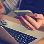 Is Pdf Expert Worth It? A Detailed Review And Comparison 7 woman holding phone while working on pc