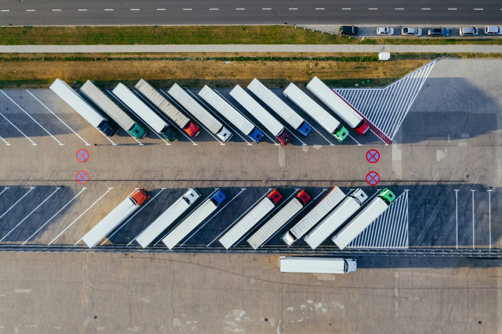 The Productivity Paradigm: Unveiling The Impact Of Transport Management System Development 1 trucks parked