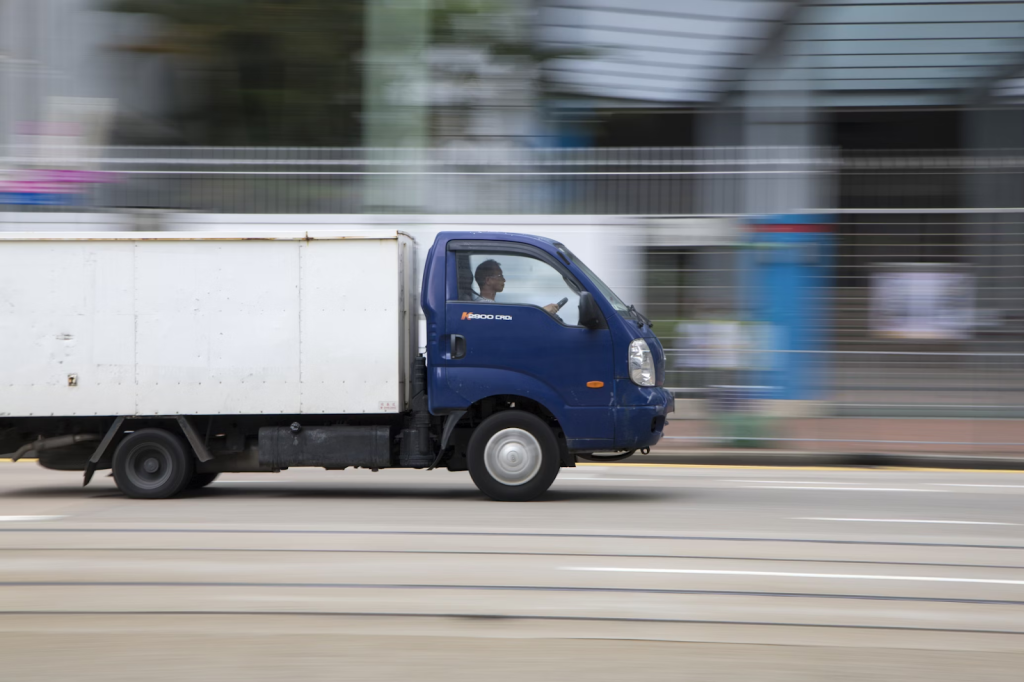Save Time And Money With Truck Rentals For Your Business Needs 3 blue and white van on road during daytime