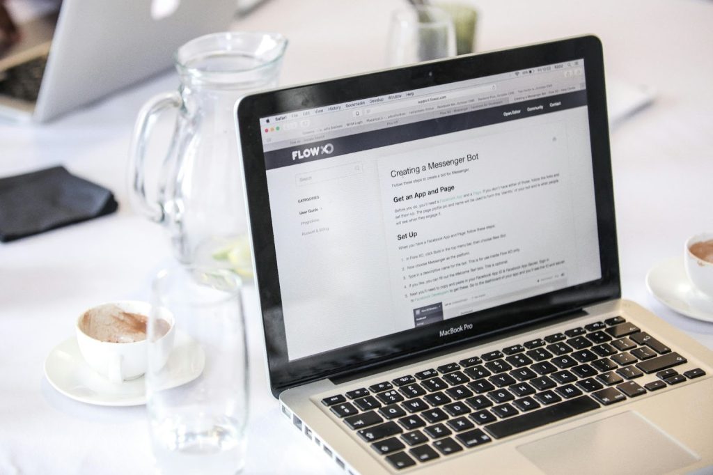 What Does Ada Compliance Mean And Why Does It Matter? 3 drinking glass beside a MacBook Pro
