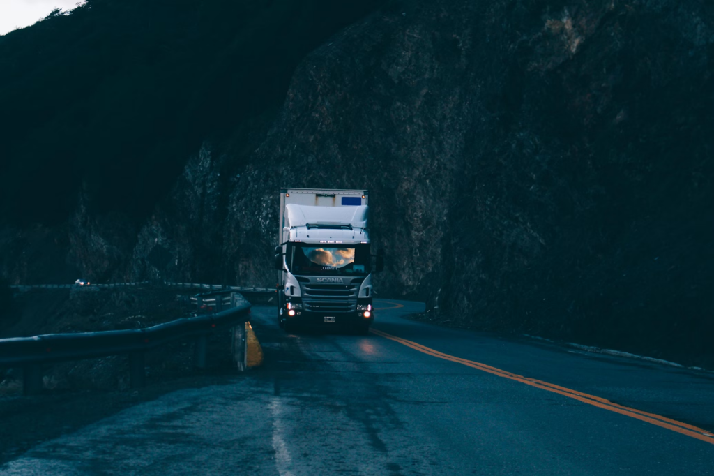 7 Essential Truck Parts For Maximizing Fleet Efficiency 1 trailer truck passing on road near rail guard
