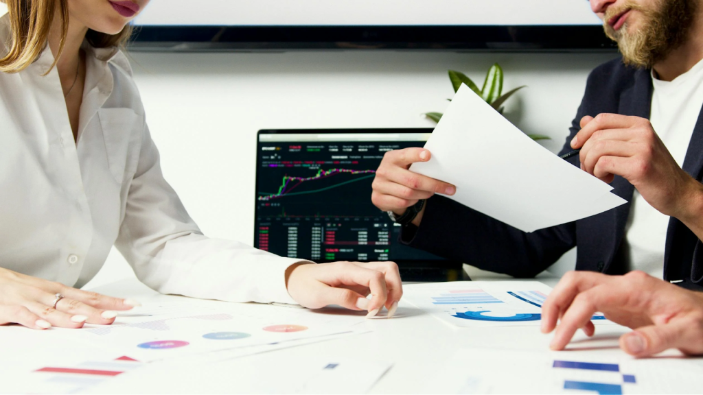 The Ultimate Guide To Selecting Investment Strategies For Leaders 3 Man and a Woman on a Business Meeting