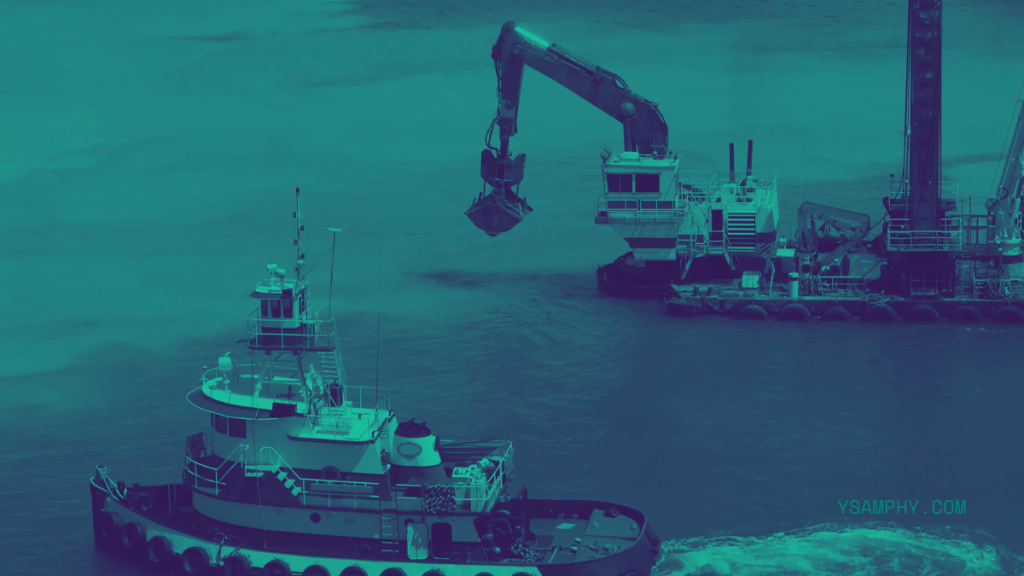 7 Features Of Top-Tier High-Performance Dredging Systems 1 a tugboat and dredge working the harbor