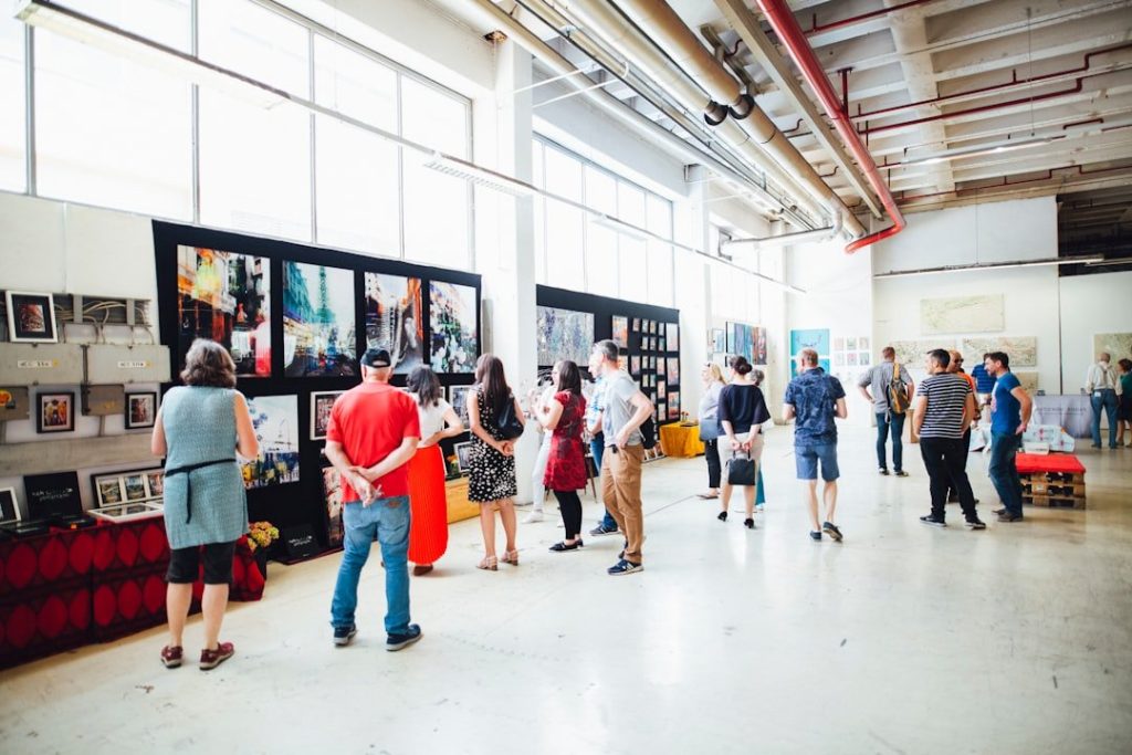Key Elements Of Successful Exhibit Design For Trade Shows 3 people watching photos