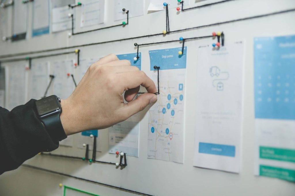 Mastering Personal Workflow Management For Enhanced Productivity 1 person working on blue and white paper on board