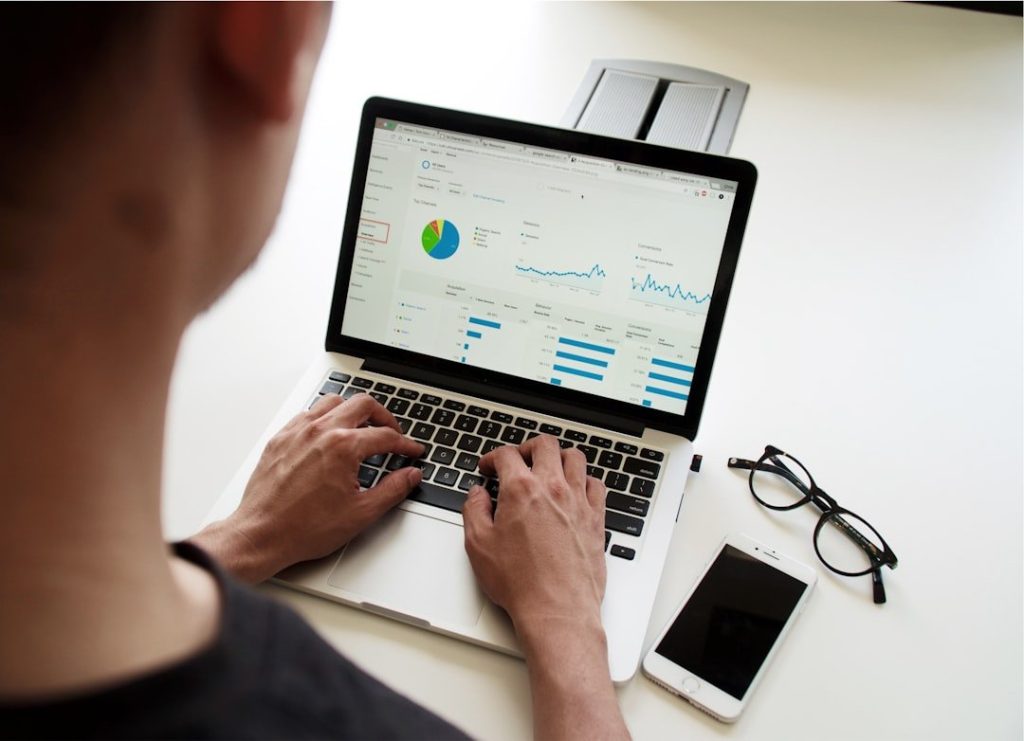 Enhancing Sales Forecast Accuracy With Data-Driven Strategies 1 person using MacBook Pro