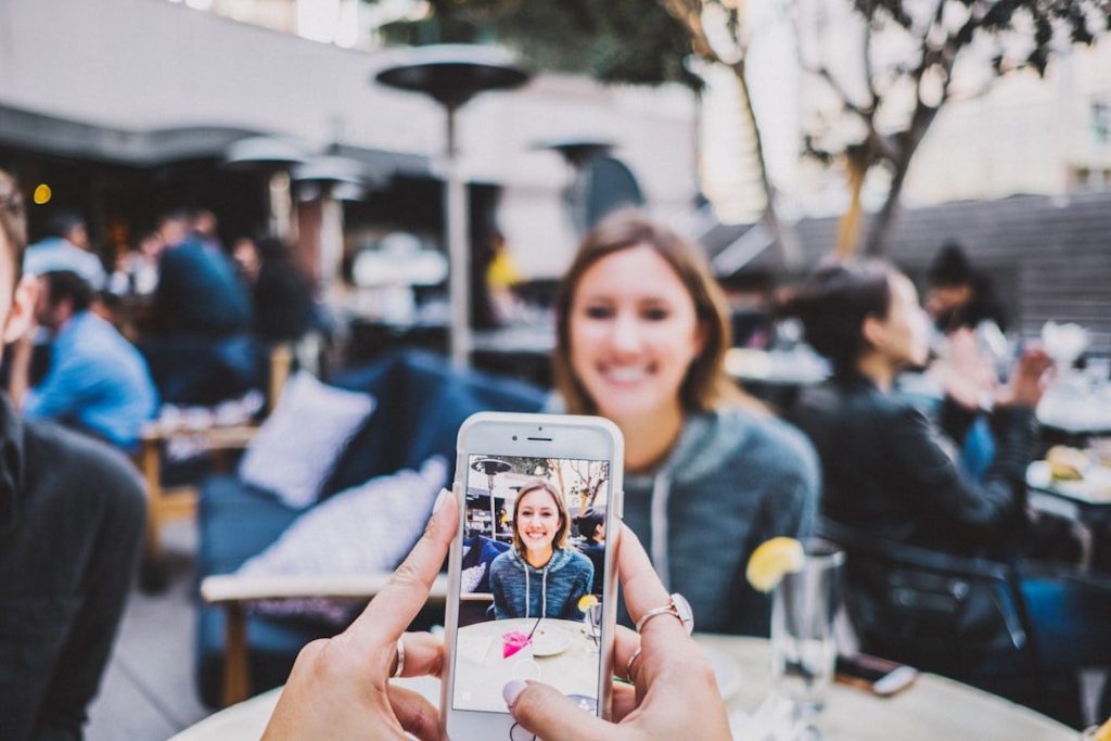 6 Ways Businesses Can Use Videos To Enhance Professional Communication And Engagement 3 person taking photo of woman
