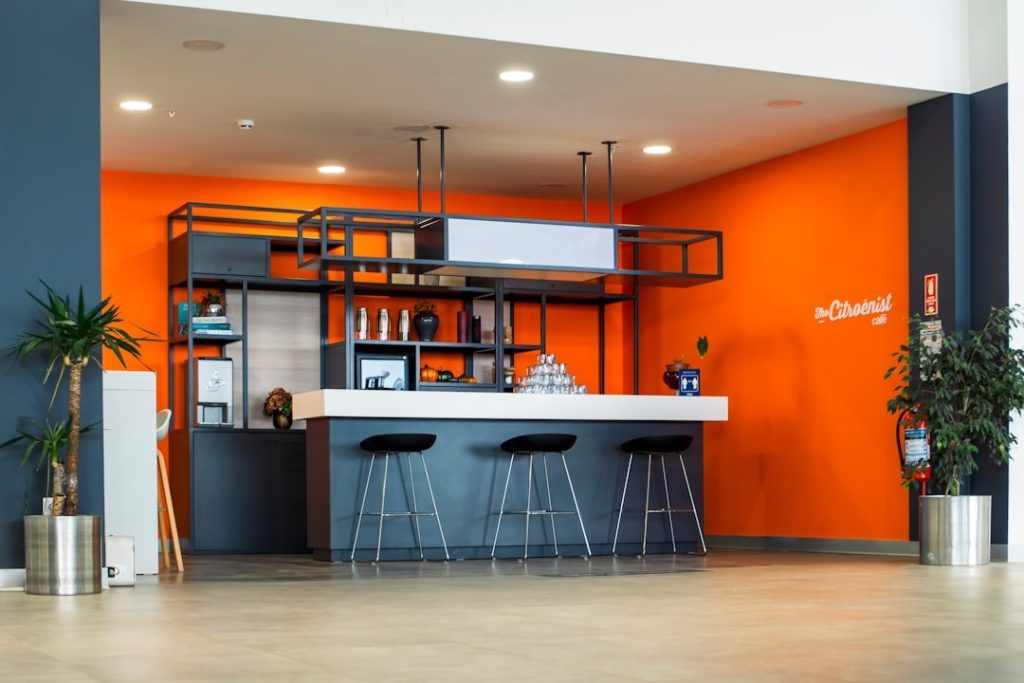 The Ins And Outs Of Opening Your Own Auto Repair Shop 1 An orange and blue room with bar stools